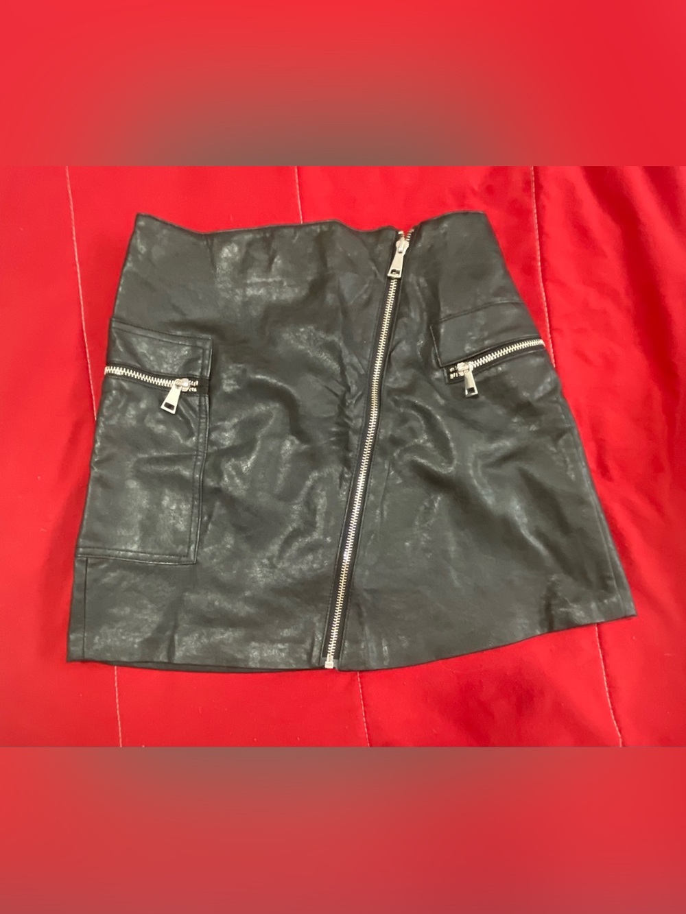 Faux Leather Black Mini Skirt with Diagonal Zip & Pocket Details